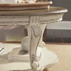 Ashley Furniture Tables Realyn - White/brown - Oval Cocktail Table