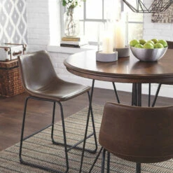Signature Design By Ashley® Centiar - Dark Brown - 5 Pc. - Round Counter Table, 4 Upholstered Barstools