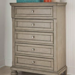 Ashley Furniture Lettner - Light Gray - Five Drawer Chest - Central Handle