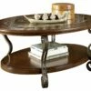 Ashley Furniture Tables Nestor - Medium Brown - Oval Cocktail Table