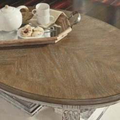 Ashley Furniture Tables Realyn - White/brown - Oval Cocktail Table